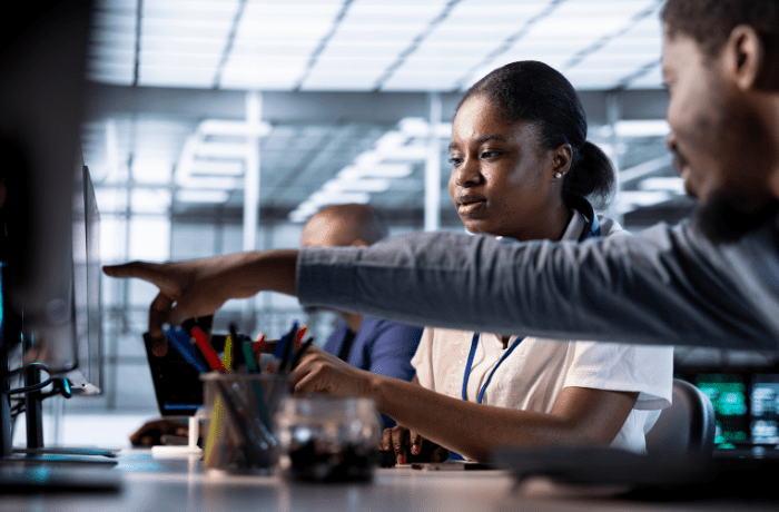 African students participating in digital skills training with mentorship and hands-on learning, representing upskilling Africa’s tech workforce.
